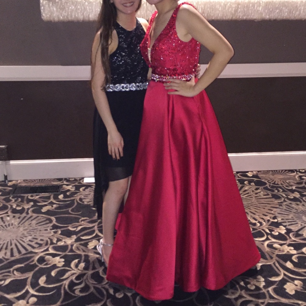 A beautiful red designer prom dress/gown
